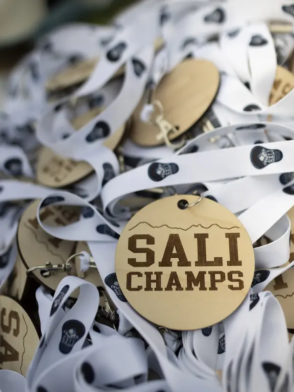 Wooden SALI Champs medals on white ribbons