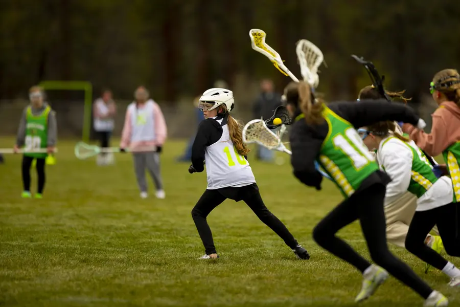 Girls players contest a draw at midfield