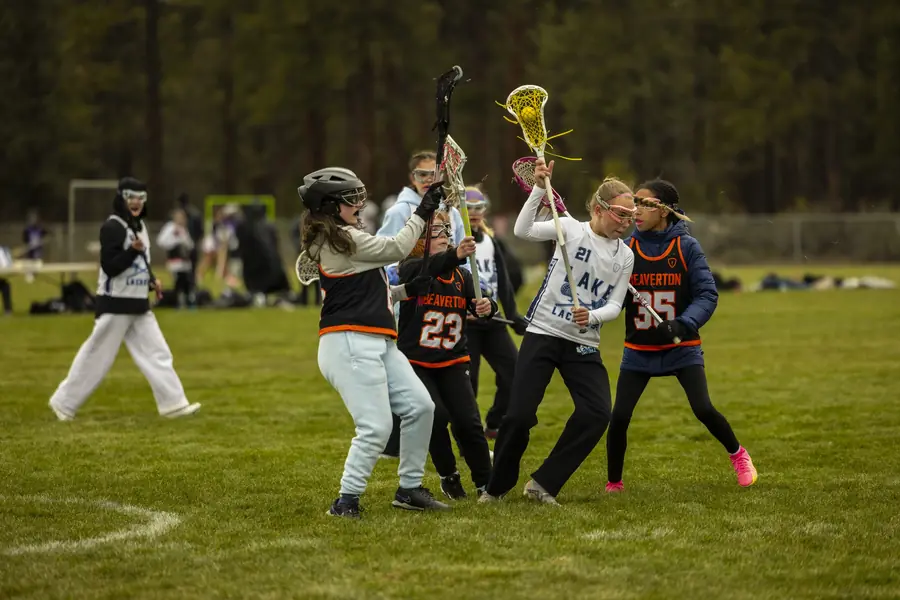 Girls players battle for a loose ball