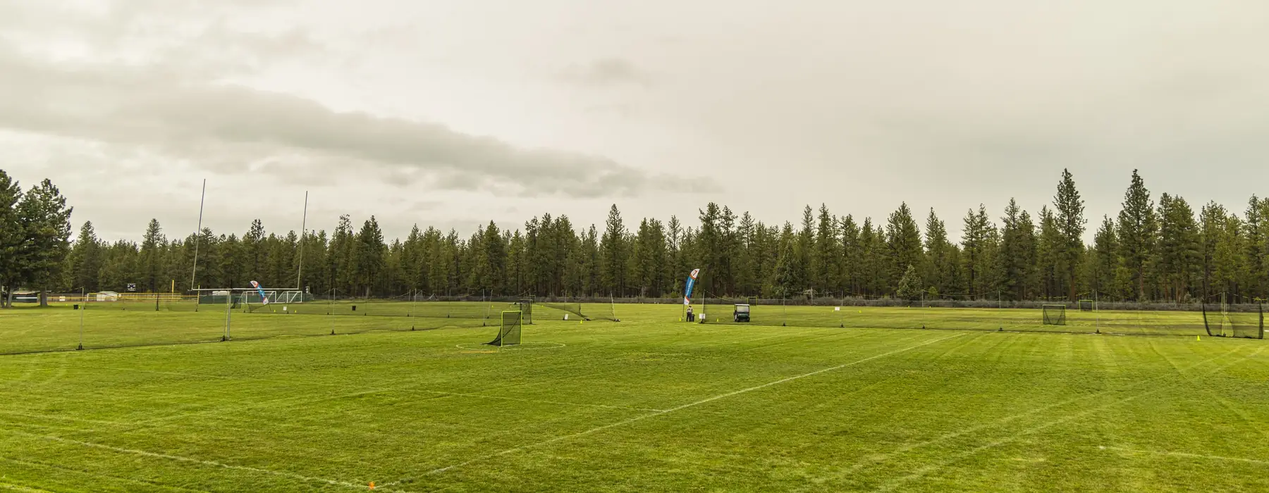 Tournament fields in Sisters, ringed by ponderosa pines